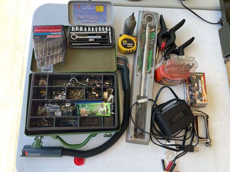 Lot includes small socket set, ￼ torque, wrench, drill, bits, and miscellaneous.