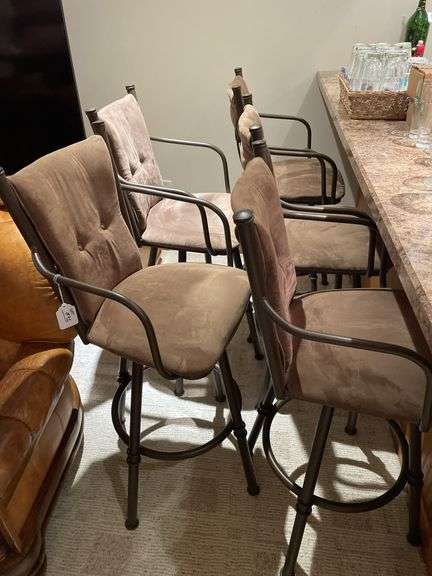Basement. Five barstools. Cushioned and in good condition. By the piece times bid.
