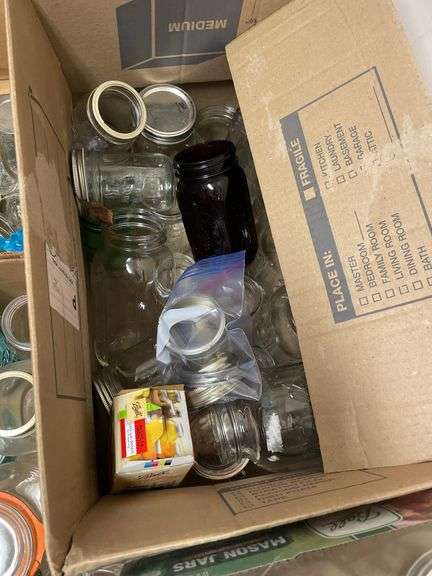 Lot of mason jars with lids.