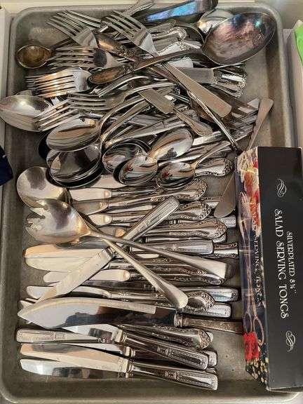 Lot of flatware. In dining room.