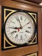 Basement. 31 day regulator clock. Approximately 24 inches tall. Includes key.