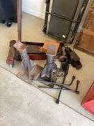 Automotive lot includes floor jacks, creepers, tire irons.