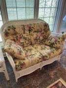 Sunroom. Lot of quality wicker furniture. Including loveseat. Two side chairs with Ottomans. Glass top wicker side tables. Includes floral cushions in good shape. With two matching lamps.