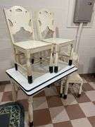 Basement. Enamel top vintage table with three matching wooden chairs. Table is 40 inches wide.