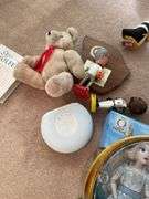 Living room. Lot of dolls and miscellaneous collectibles under table.