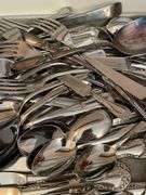 Lot of flatware. In dining room.