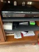 Living room. 40 inch Sony Bravia KDL – 40 XBR6 TV with remote powers on and is working includes Philips Magnavox DVD player.