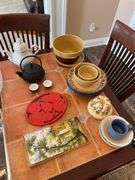 Kitchen. Over and back yellow Ware, bowls. Tea kettle with small tea, cups, and miscellaneous.