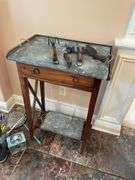 Sunroom. Gardener side table with galvanized top,  with decor tools. Approximately 3 feet tall.