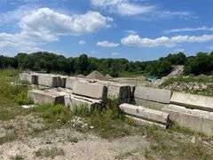 Approximately 84 stackable concrete Bin Blocks. Approximately 6’x2’x2’