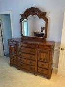 High quality king bedroom includes newer beauty rest king size mattress with bedding and Laura Ashley home ornate frame and headboard. Laura Ashley home Matching nightstands that have cabinets in them matching headboard made of hardwood. Leather top ottoman. With matching Laura Ashley home dresser with mirror..  High quality bedding included.  Clean pet free home