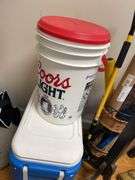 corner lot includes umbrellas, coolers, coat, rack, umbrella, stand, and miscellaneous.