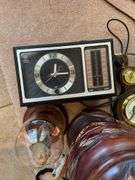 Cool decorative lot includes brass bookends, duck, barometer, vintage radio.