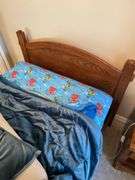 Quality twin bedroom set. Two single beds with frame and Sealy Posturepedic mattresses and bedding. Matching dresser, nightstand, bookshelf cabinet. Includes lamp on nightstand and miscellaneous items in drawers and shelves.