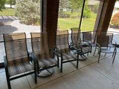Outdoor set includes four chairs and round table also includes three miscellaneous outdoor side chairs