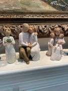 Living room. A collection of Willow tree figurines. Some have original boxes.