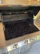 Jen air stainless gas grill and cover. Includes one tank.