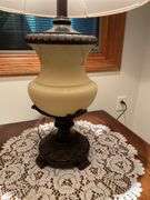 Basement. Side table with large ornate lamp. Side table is 28 inches wide.