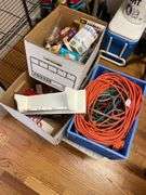 Lot includes plastic table, fire extinguisher, miscellaneous extension, cords, and lightbulbs