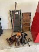 Automotive lot includes floor jacks, creepers, tire irons.