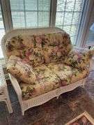 Sunroom. Lot of quality wicker furniture. Including loveseat. Two side chairs with Ottomans. Glass top wicker side tables. Includes floral cushions in good shape. With two matching lamps.