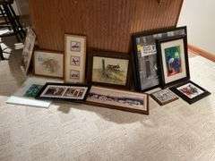 Basement. Large lot of framed wall art includes some prints photographs unique scenes. Nice variety review pictures for all pieces.