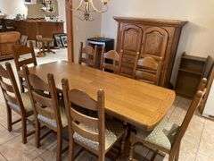 Country dining set in Oak, 34 x 83 pedestal table with eight ladder back chairs. Chairs are very solid and this is a nice quality set. Also includes Oak side cabinet with drawers. Easy loadout through walkout basement.
