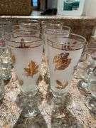 Basement. Beer, glasses, and vintage pillsner glasses.