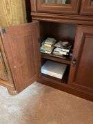 Glass fronted curio cabinet. Approximately 70 inches tall by 24 inches wide.