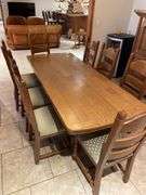Country dining set in Oak, 34 x 83 pedestal table with eight ladder back chairs. Chairs are very solid and this is a nice quality set. Also includes Oak side cabinet with drawers. Easy loadout through walkout basement.