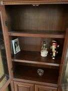 Glass fronted curio cabinet. Approximately 70 inches tall by 24 inches wide.