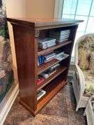 Sunroom. Bookshelf. 48 inches tall 36 inches wide. Well-made hardwood includes some cookbooks magazines.