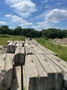 Approximately 84 stackable concrete Bin Blocks. Approximately 6’x2’x2’