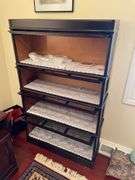 Den. Vintage barrister case with glass front drop-down doors. Approximately 57 inches tall and 34 inches wide.