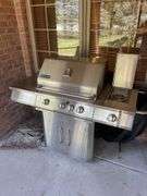 Jen air stainless gas grill and cover. Includes one tank.