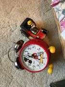 Bedroom. Wonderland classical piano in box. Mickey Mouse clock in toy with doll and basket.