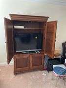 Living room. Entertainment cabinet. 78 inches tall 43 inches wide 25 inches deep.