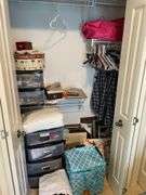 Contents of closet in children’s bedroom. Includes framed prints. Pillows. Some clothing. Fans, craft items, Miscellaneous.