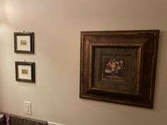 First floor half bath. Four framed art pieces.