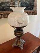 Entryway. Glass front curio. 30 x 28” with oil style electric lamp.