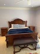 High quality king bedroom includes newer beauty rest king size mattress with bedding and Laura Ashley home ornate frame and headboard. Laura Ashley home Matching nightstands that have cabinets in them matching headboard made of hardwood. Leather top ottoman. With matching Laura Ashley home dresser with mirror..  High quality bedding included.  Clean pet free home