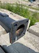 Lengths of heavy gauge pipe and approximately 30 foot long light pole/mast