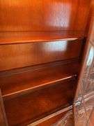 Dining room. Ebert furniture company glass China Cabinet, very high quality. 52 inches wide 80 inches tall. With light inside in good condition Cherrywood finish.