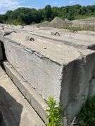 Approximately 84 stackable concrete Bin Blocks. Approximately 6’x2’x2’