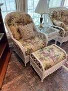 Sunroom. Lot of quality wicker furniture. Including loveseat. Two side chairs with Ottomans. Glass top wicker side tables. Includes floral cushions in good shape. With two matching lamps.