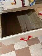 Basement. Vintage kitchen Hosier cabinet.  Painted White with red handles. Approximately 71 inches tall by 39 inches wide. Nice piece.
