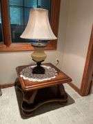 Basement. Side table with large ornate lamp. Side table is 28 inches wide.