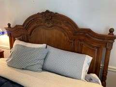 High quality king bedroom includes newer beauty rest king size mattress with bedding and Laura Ashley home ornate frame and headboard. Laura Ashley home Matching nightstands that have cabinets in them matching headboard made of hardwood. Leather top ottoman. With matching Laura Ashley home dresser with mirror..  High quality bedding included.  Clean pet free home