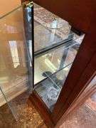 Entryway. Glass front curio. 30 x 28” with oil style electric lamp.