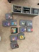 Living room. Lot of Nintendo games. Featuring Mario. Simpsons. Other unique and classic titles. Includes VHS of Nirvana live tonight sold out.